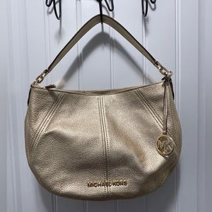 Who doesn’t love a great purse? Never used. Michael Kors